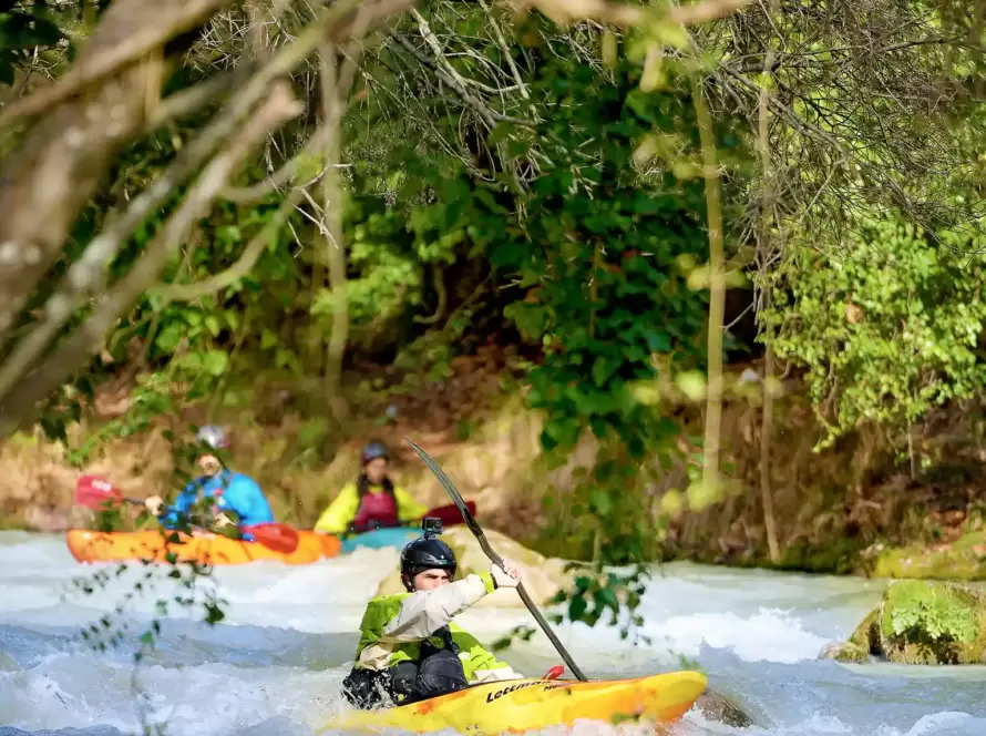 People river kayaking in Greece.