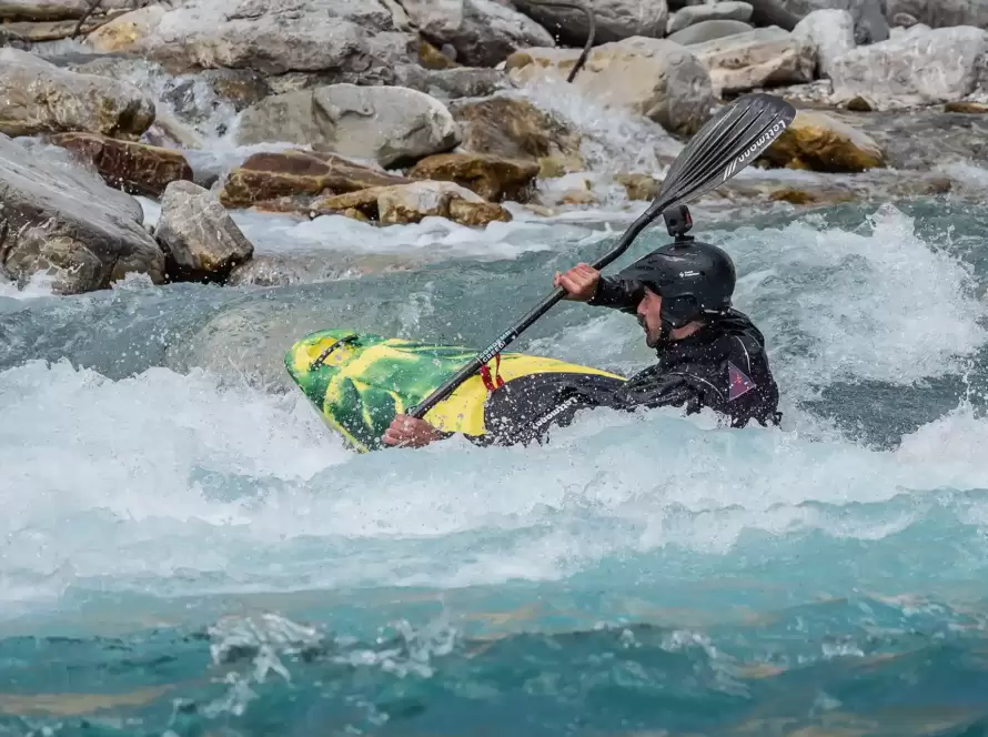 A person kayaks in a river in Greece.