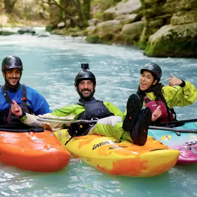 Three kayakers pose for a fun picture