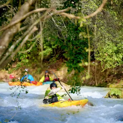 People river kayaking in Greece.