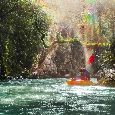 A person kayaks in a river in Greece.