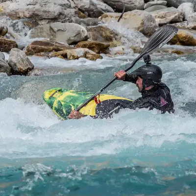 A person kayaks in a river in Greece.